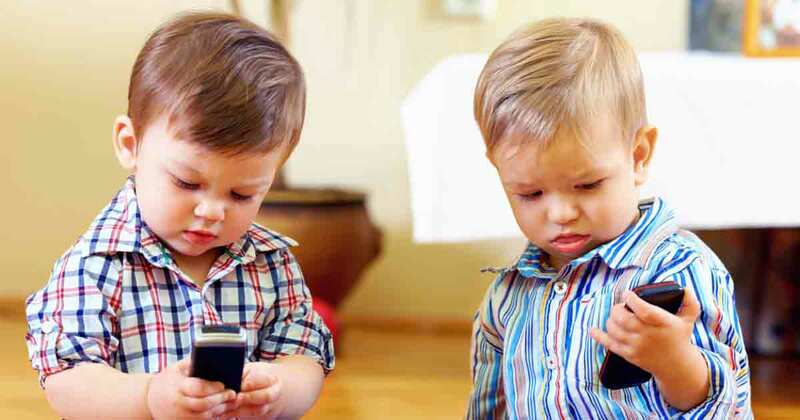 two-toddlers-cellphone-fb.jpg