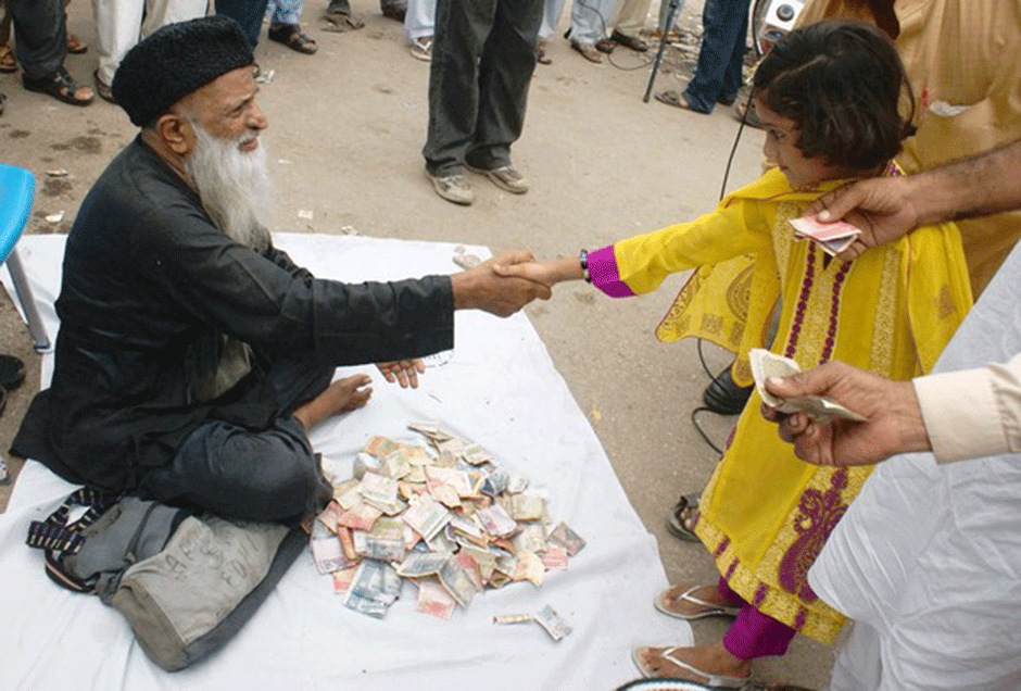 Abdul Sattar Edhi collects donations on a side street in Karachi